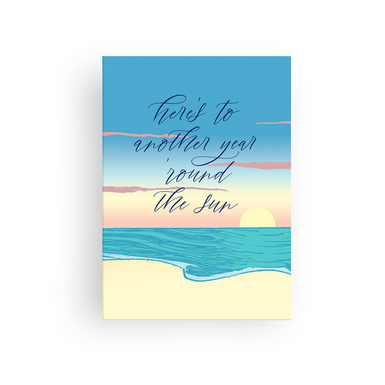 This lovely birthday card features an image of the sun setting at the beach with the message, "Here's to another year 'round the sun." Inside, the card reads, "Happy birthday!" 